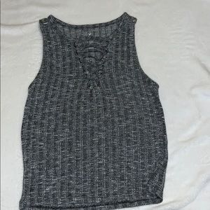 a cute crop top with a criss cross v neck